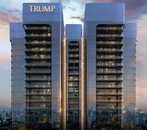 Trump Residences twin towers at dusk above the Gurugram skyline